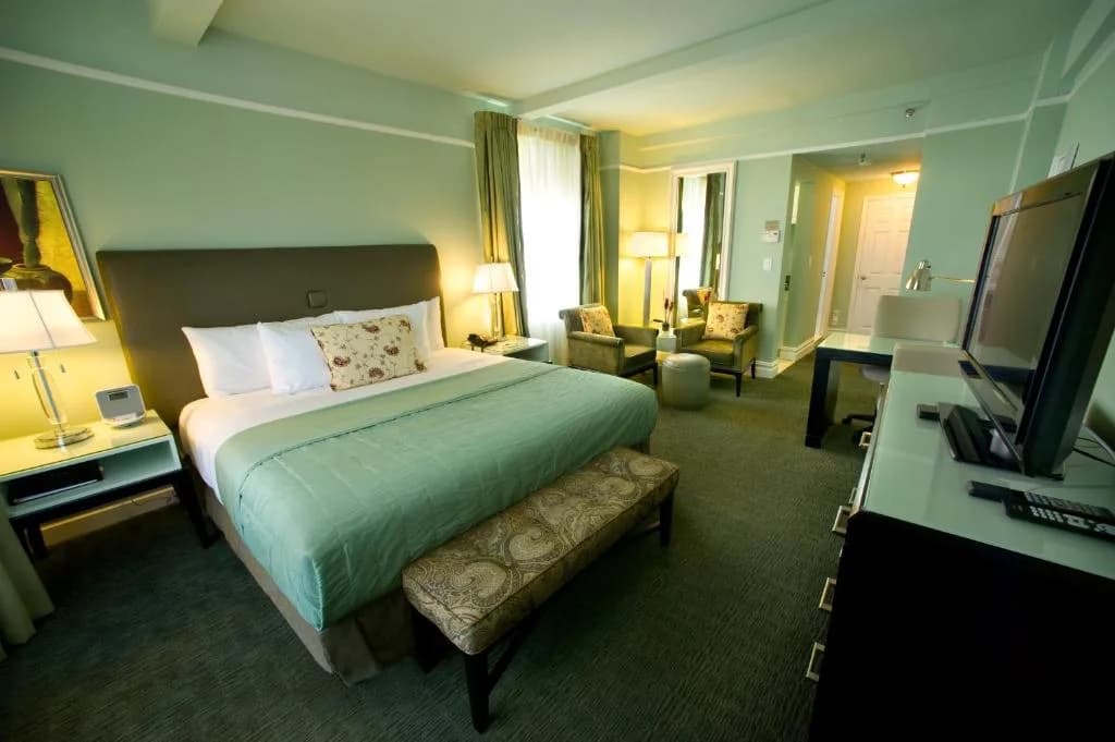 a hotel room with a bed and a television at Hotel Beacon in New York