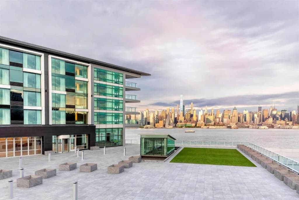 an office building with a view of the city at Envue, Autograph Collection in Weehawken