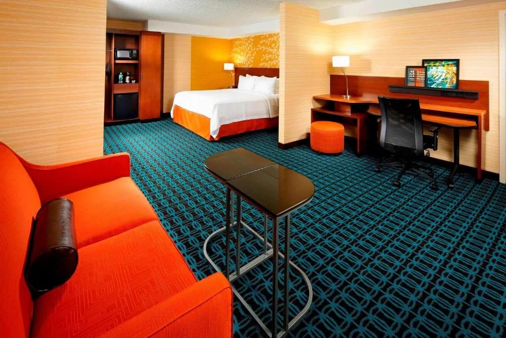 a hotel room with a bed and a desk at Fairfield Inn by Marriott East Rutherford Meadowlands in East Rutherford