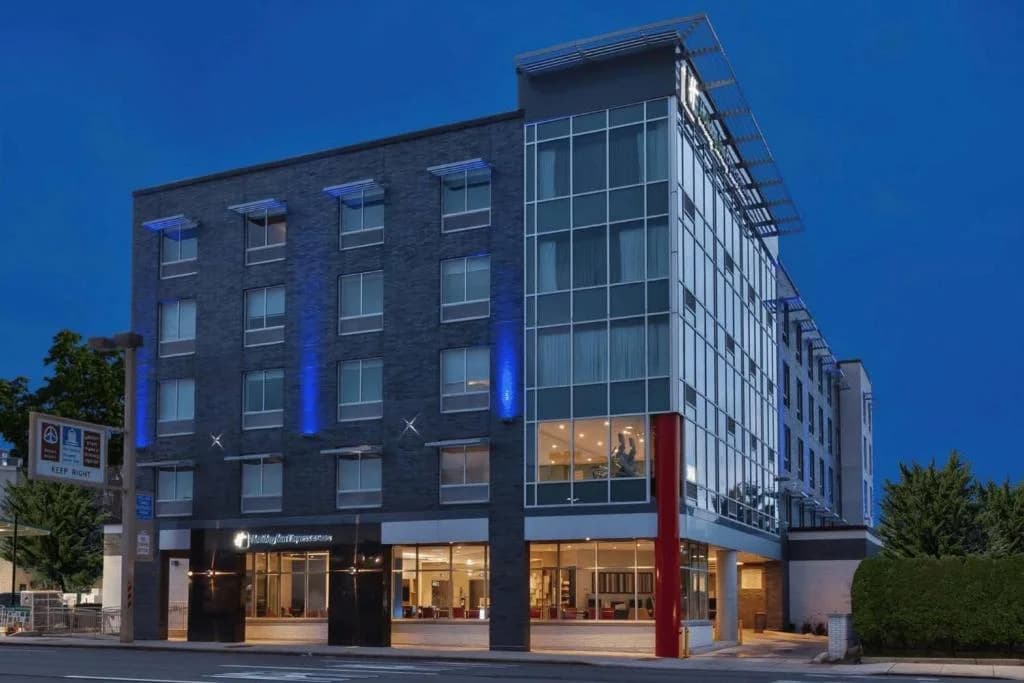 a building with blue lights on the side of it at Holiday Inn Express & Suites Jersey City - Holland Tunnel by IHG in Jersey City