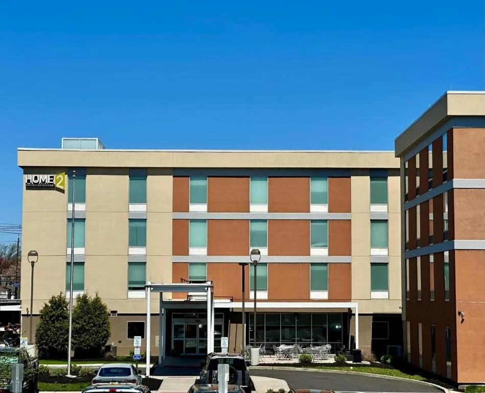 an office building with cars parked in front of it at Home2 Suites by Hilton Rahway in Rahway
