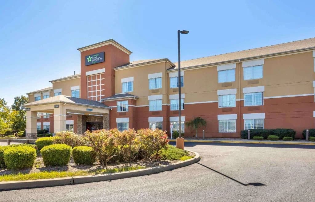 an office building with a clock on top of it at Extended Stay America Suites - Meadowlands - East Rutherford in East Rutherford