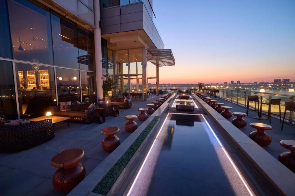 a building with a pool on top of it at Ink 48 Hotel in New York