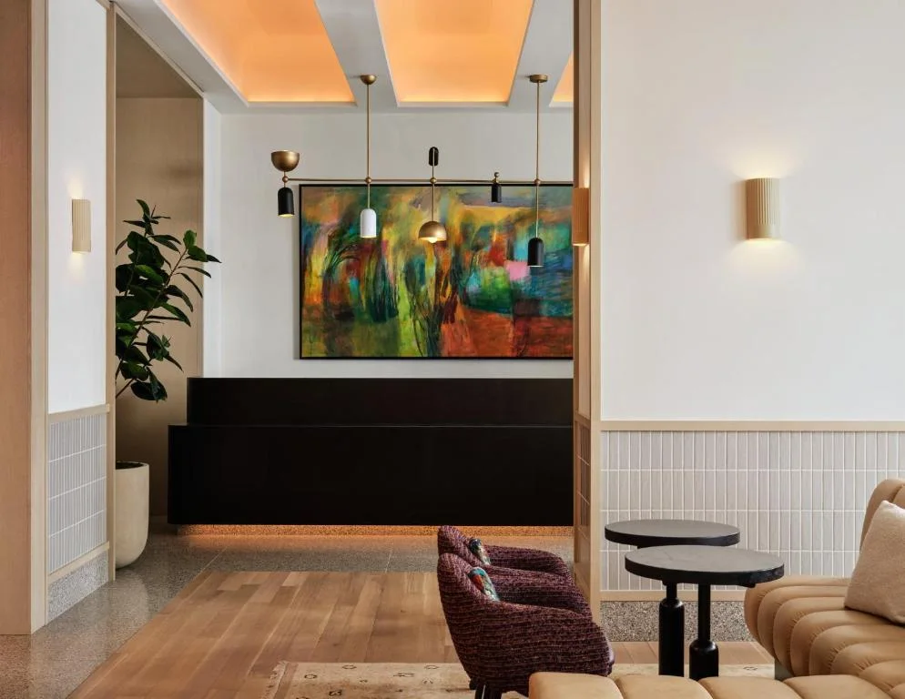 a living room with a painting on the wall at Kimpton Era Midtown New York by IHG in New York