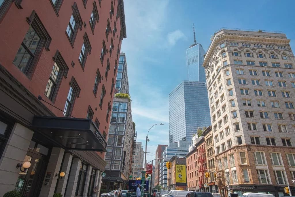 a busy city street with tall buildings and cars at The Frederick Hotel Tribeca, a Small Luxury Hotel in New York