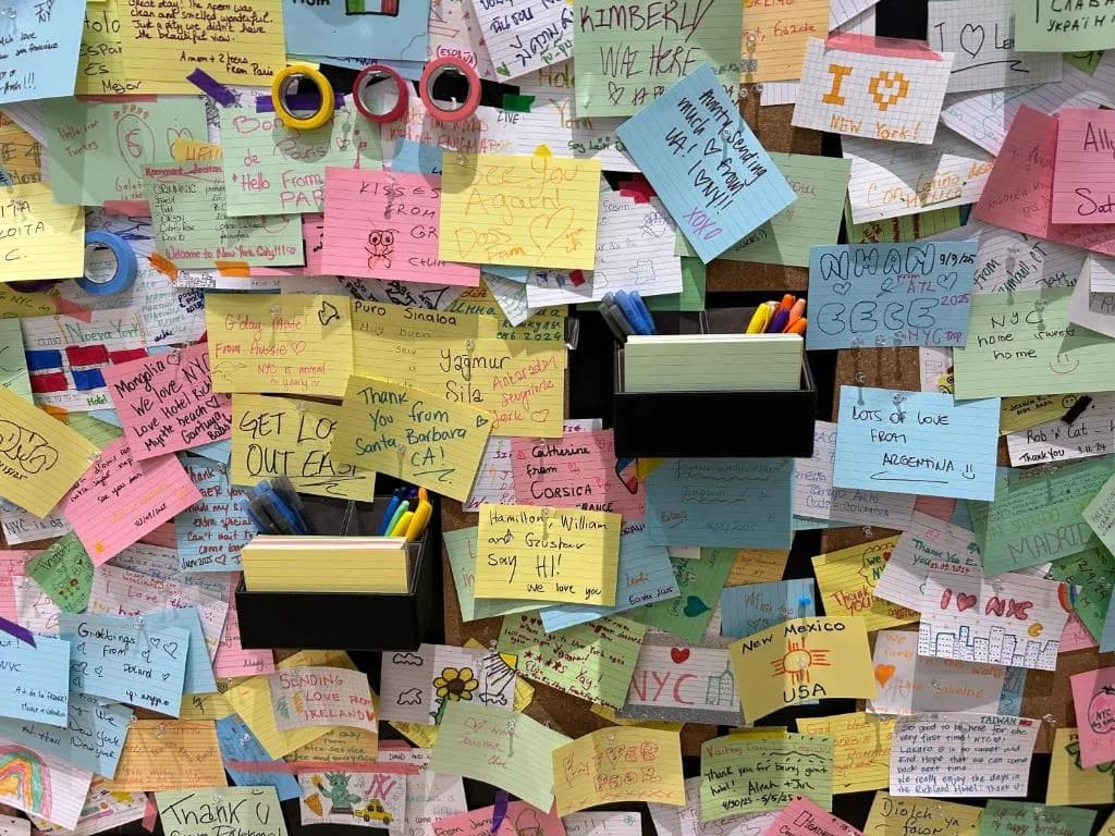 a pile of sticky notes on a wall at Hotel Richland LES in New York