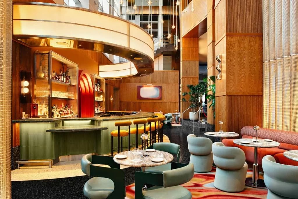 a restaurant with tables and chairs and a bar at W Hoboken in Hoboken