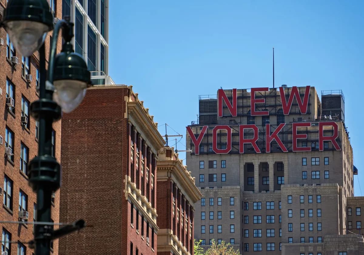 View of the New Yorker building in Manhattan against a clear blue sky.