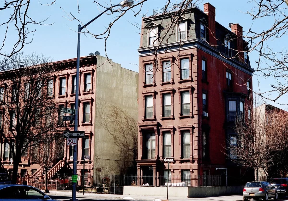 A daylight view of historic brownstone architecture on Hancock Street, Brooklyn, NYC.