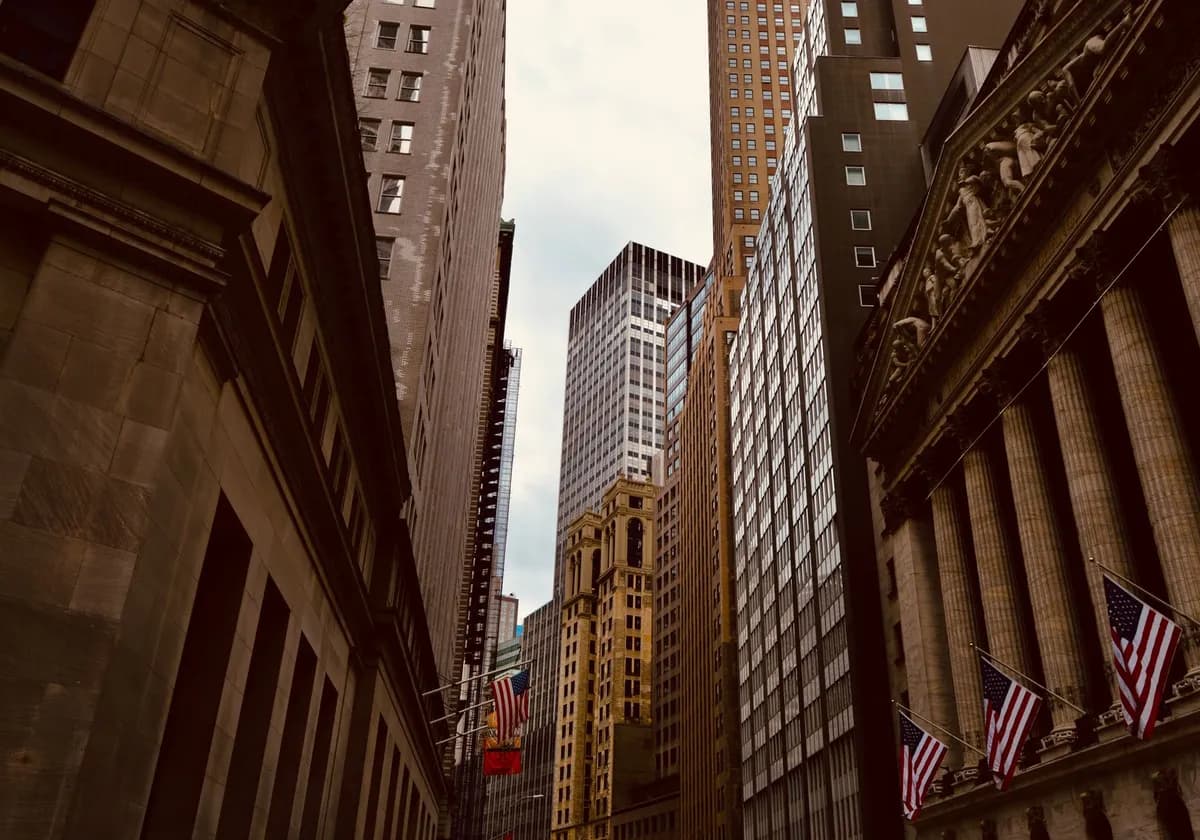 A captivating view of New York City's Wall Street, showcasing iconic architecture and urban density.