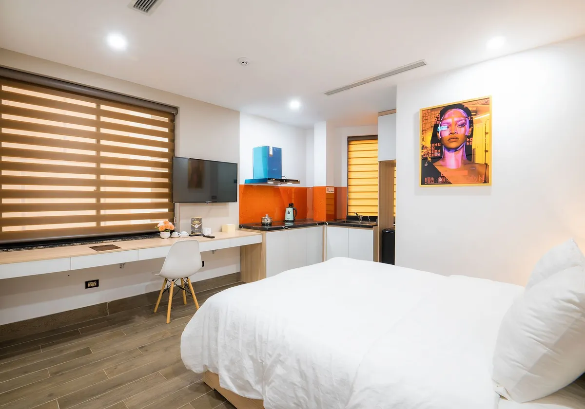 Bright modern hotel room with stylish decor and cozy ambiance.