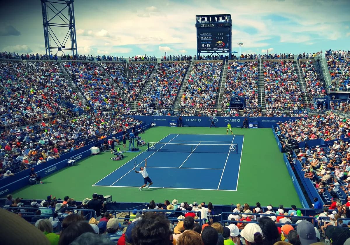 Thrilling tennis match at the US Open with a full stadium of enthusiastic fans.