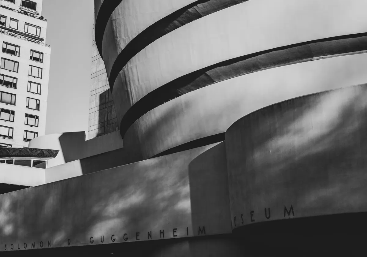 Striking black and white image of the Guggenheim Museum's iconic curves in New York City.