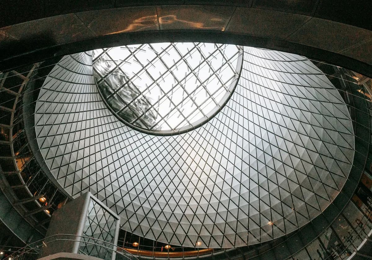 From below of glass and aluminium roof of futuristic styled subway station located in New York