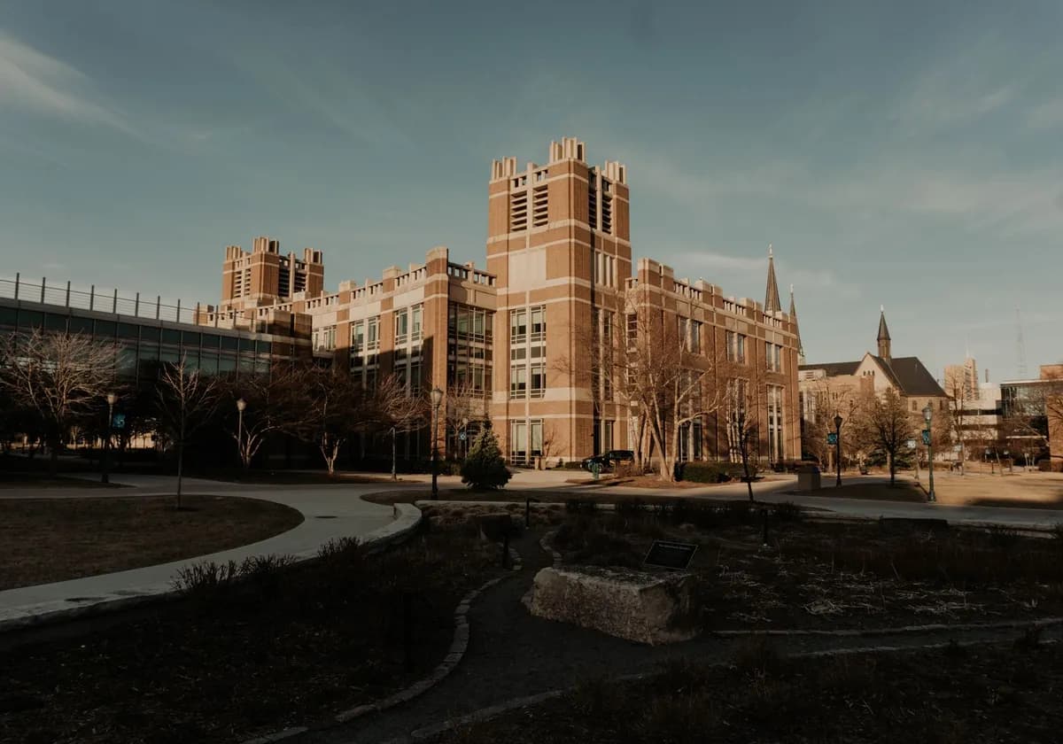 A historic campus building with classic architecture in Milwaukee, Wisconsin, under a clear sky.