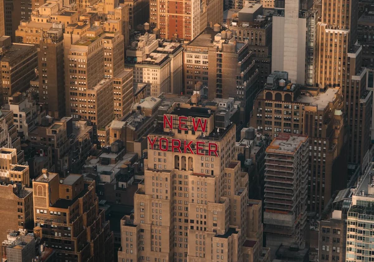Aerial view of the New Yorker Hotel amidst Manhattan's vibrant skyline.