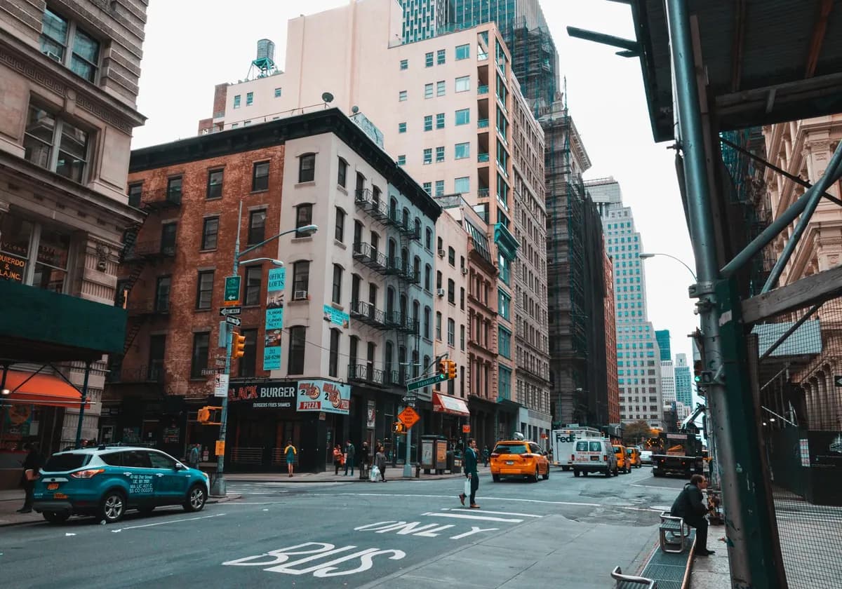Dynamic street view capturing the vibrant life and historic architecture of a busy urban city.
