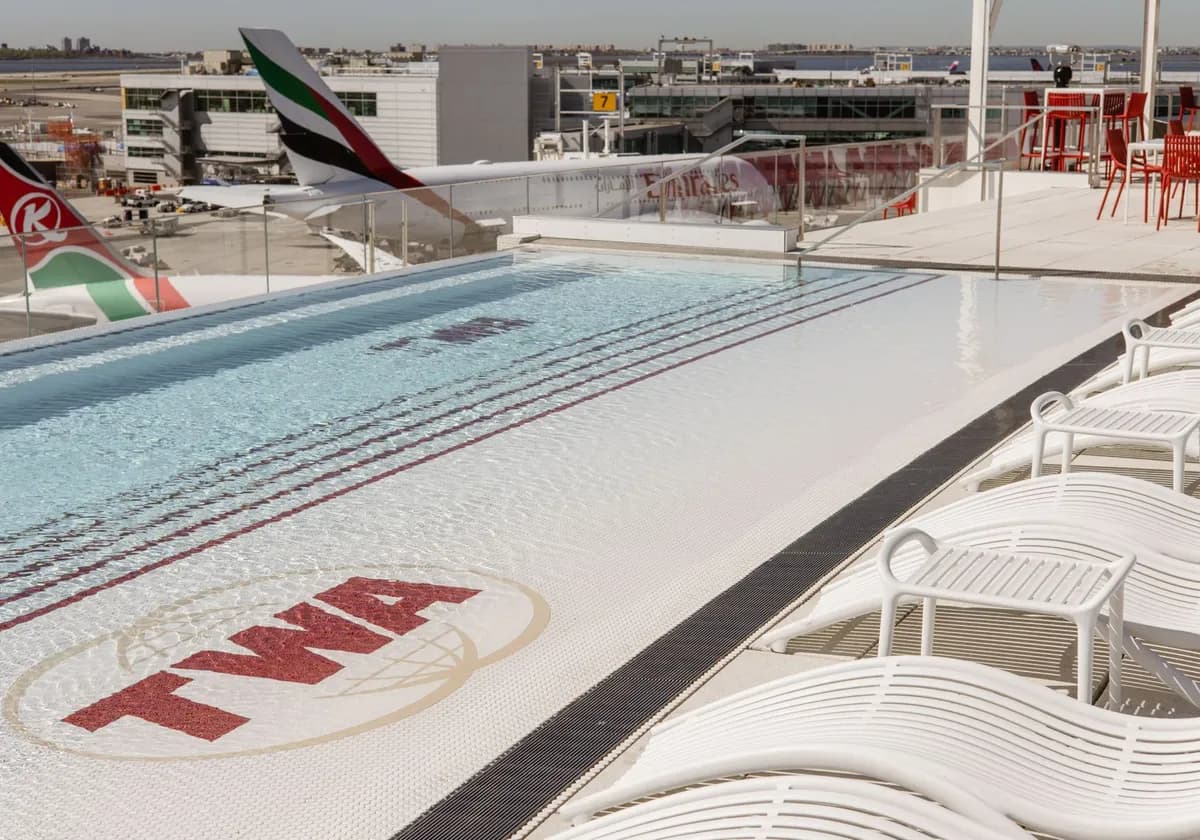 Scenic view of TWA Hotel rooftop pool with airplanes at JFK Airport, New York.