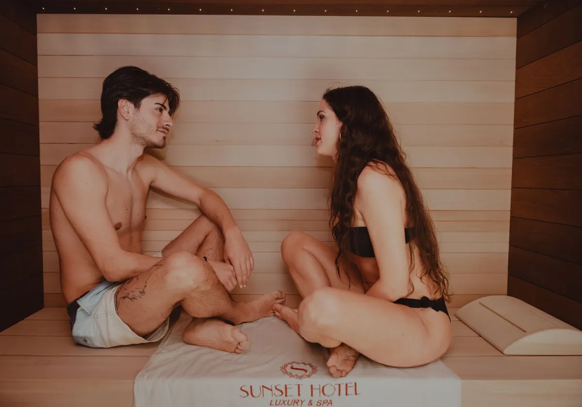 A couple enjoying a relaxing time in a sauna at a luxury spa hotel in Sicily, Italy.