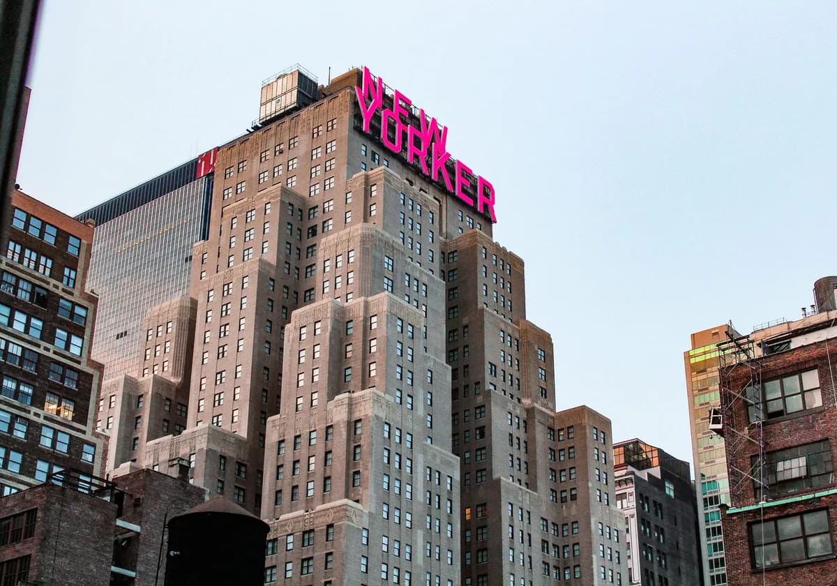 A stunning view of the New Yorker Hotel amidst the bustling cityscape of New York City.