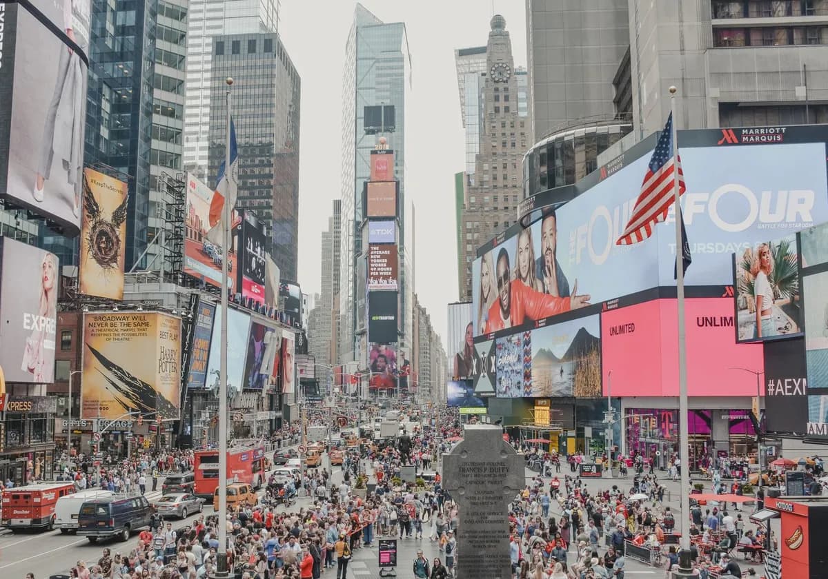 Vibrant Times Square filled with people, advertisements, and skyscrapers in New York City.
