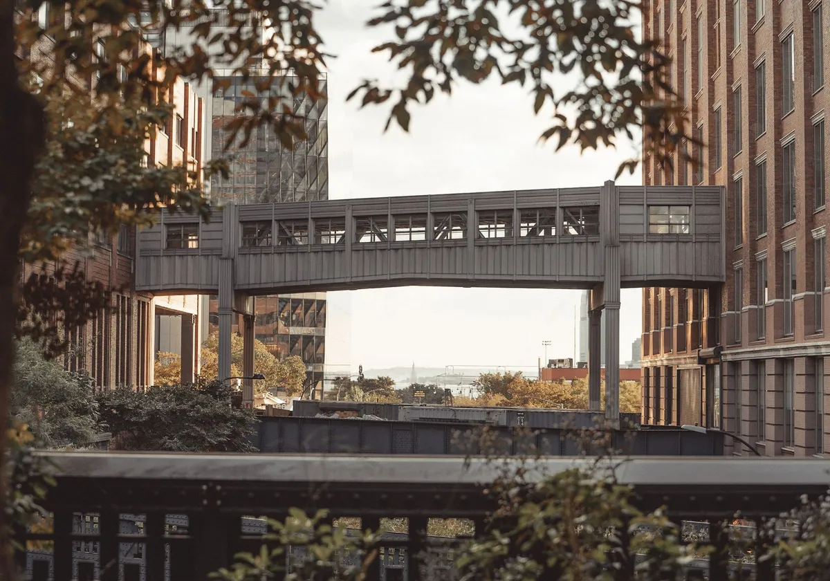 Modern architecture with a bridge over the High Line in New York City highlighting urban design.