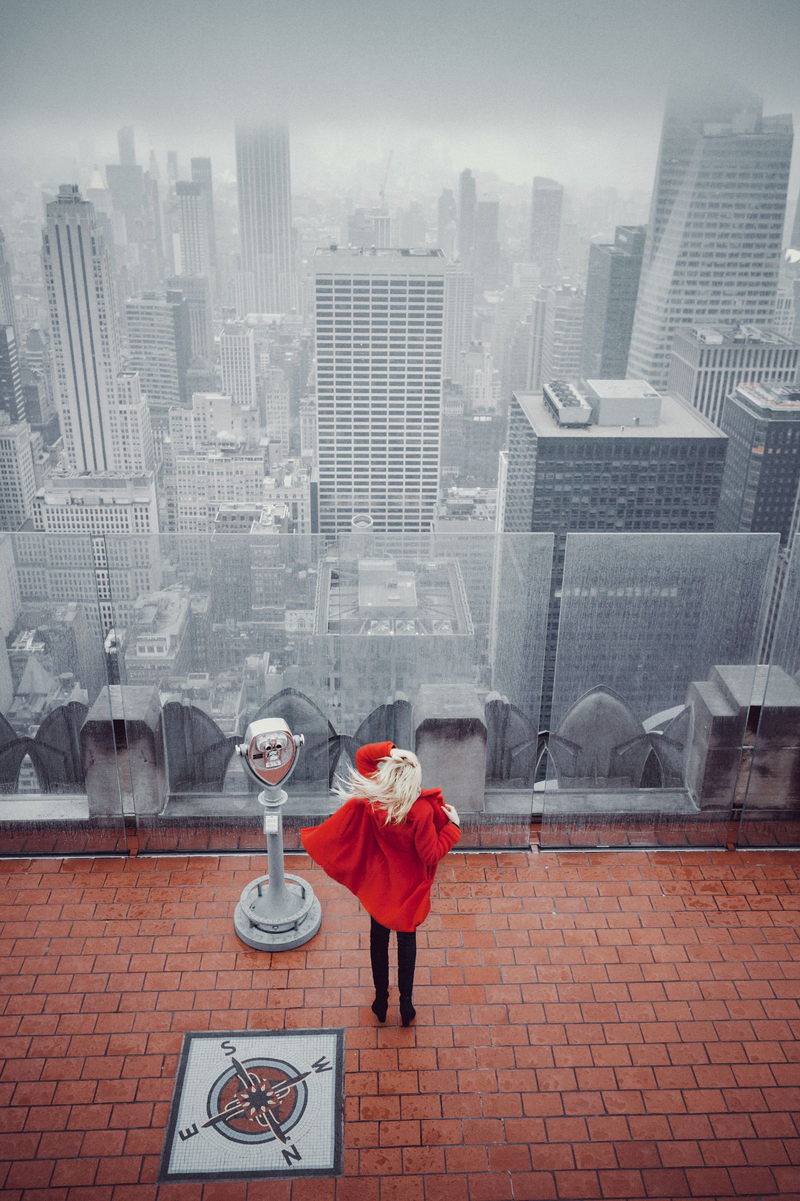 Visitor overlooking Manhattan from Top of the Rock